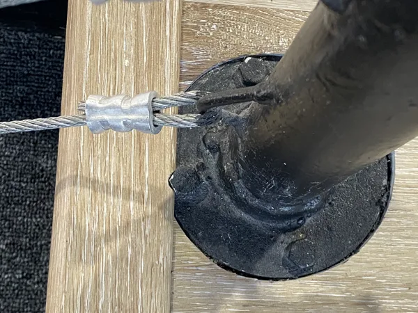 Fitted plank cuts around a railing-post base