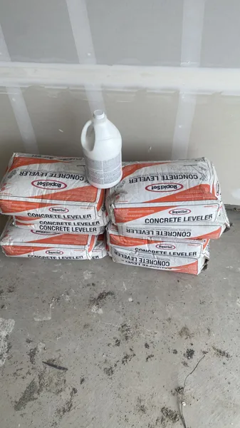 Preparation materials are staged before the finished floor covers the work underneath.