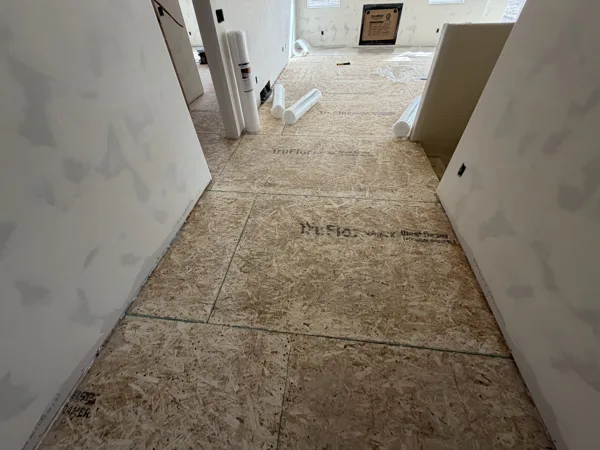 Preparation follows the route between the rooms receiving new flooring.