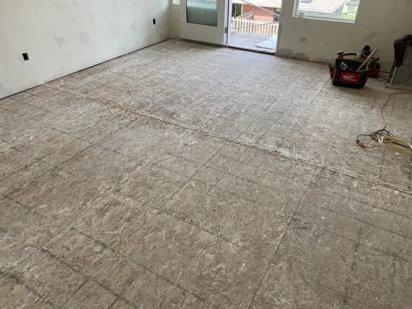 A wide room view documents the base before the finished floor is added.