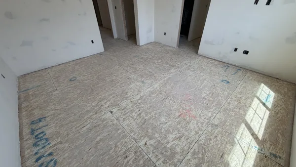A cleared room reveals the surface beneath the finished flooring.