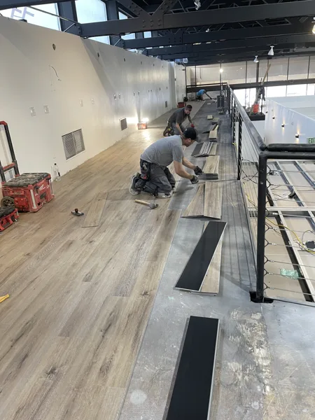 A view of the LVP installation work, finished areas or flooring details at The Beauty Stop.