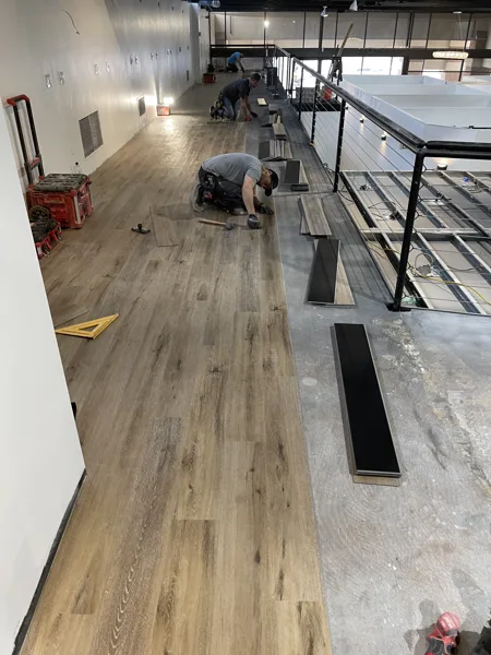 A view of the LVP installation work, finished areas or flooring details at The Beauty Stop.