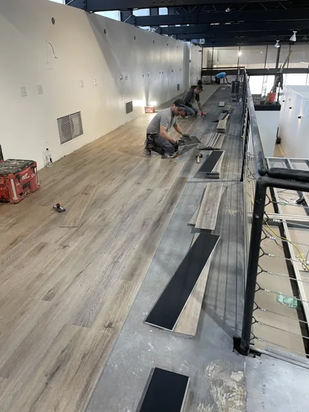 A view of the LVP installation work, finished areas or flooring details at The Beauty Stop.