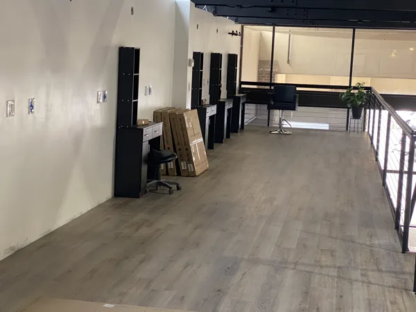 A view of the LVP installation work, finished areas or flooring details at The Beauty Stop.