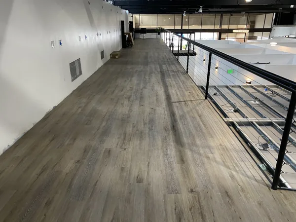 A view of the LVP installation work, finished areas or flooring details at The Beauty Stop.