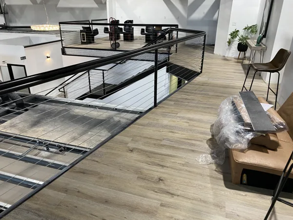 A view of the LVP installation work, finished areas or flooring details at The Beauty Stop.