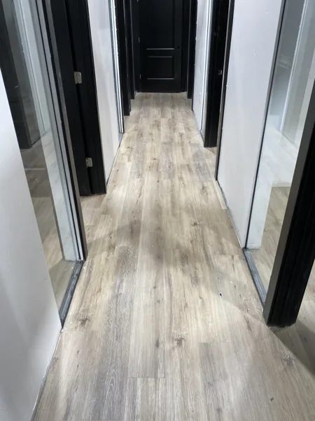 A view of the LVP installation work, finished areas or flooring details at The Beauty Stop.