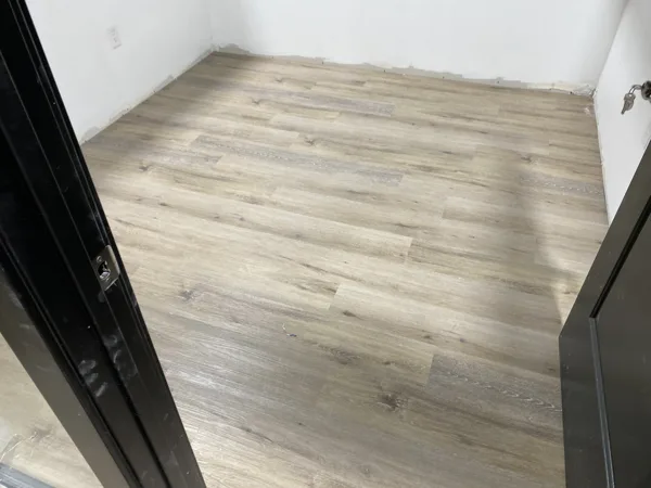 A view of the LVP installation work, finished areas or flooring details at The Beauty Stop.