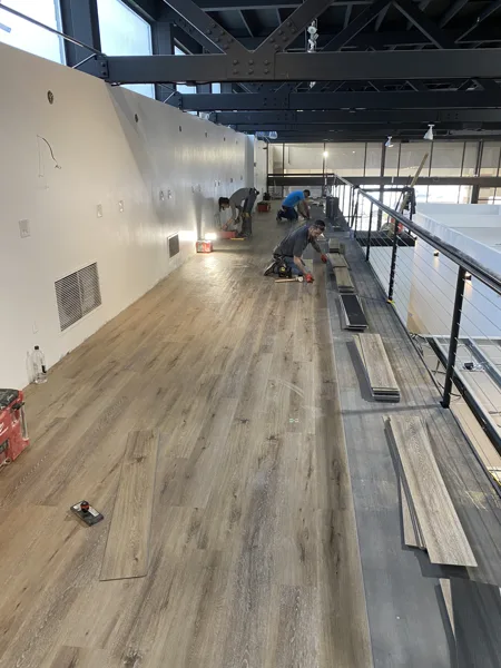 A view of the LVP installation work, finished areas or flooring details at The Beauty Stop.