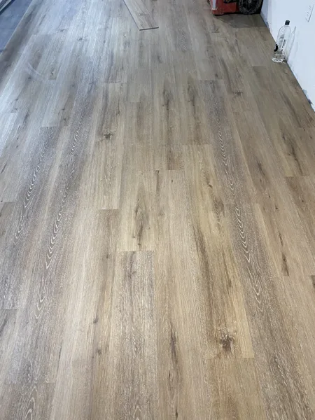 A view of the LVP installation work, finished areas or flooring details at The Beauty Stop.
