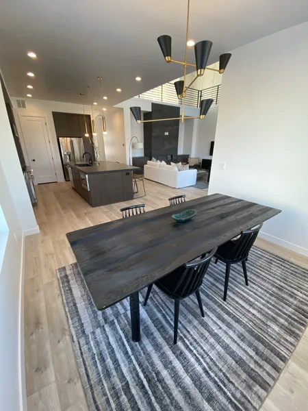 Laminate planks connect the kitchen, dining and living areas.