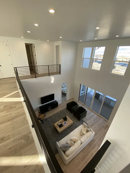 A view across the model home’s open living space and railings.