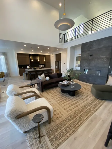 Laminate across the main living area near the seating and fireplace.