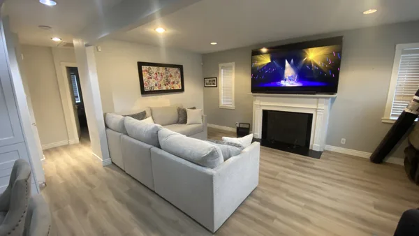 Wood-look plank flooring through the bungalow’s living area and adjoining kitchen.