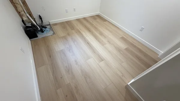 Replacement plank flooring in the basement rooms and hallway.